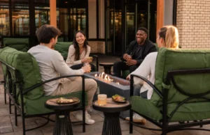 9 Residents relax around an outdoor fire table on the community patio